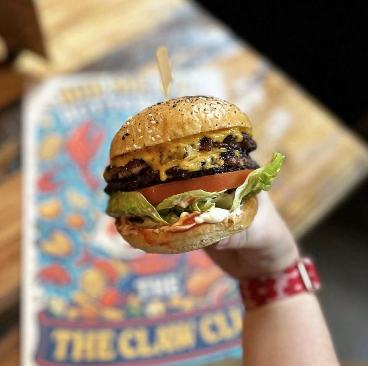 A Claw Club cheeseburger with fries